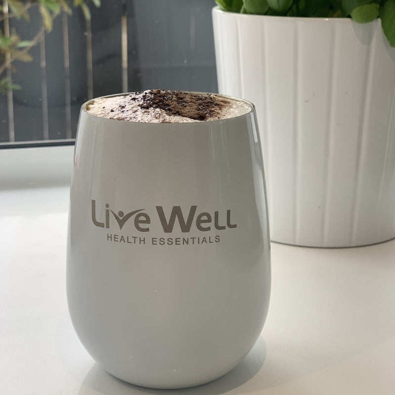 Live Well Health Essentials hot and cold tumbler in white filled with coffee